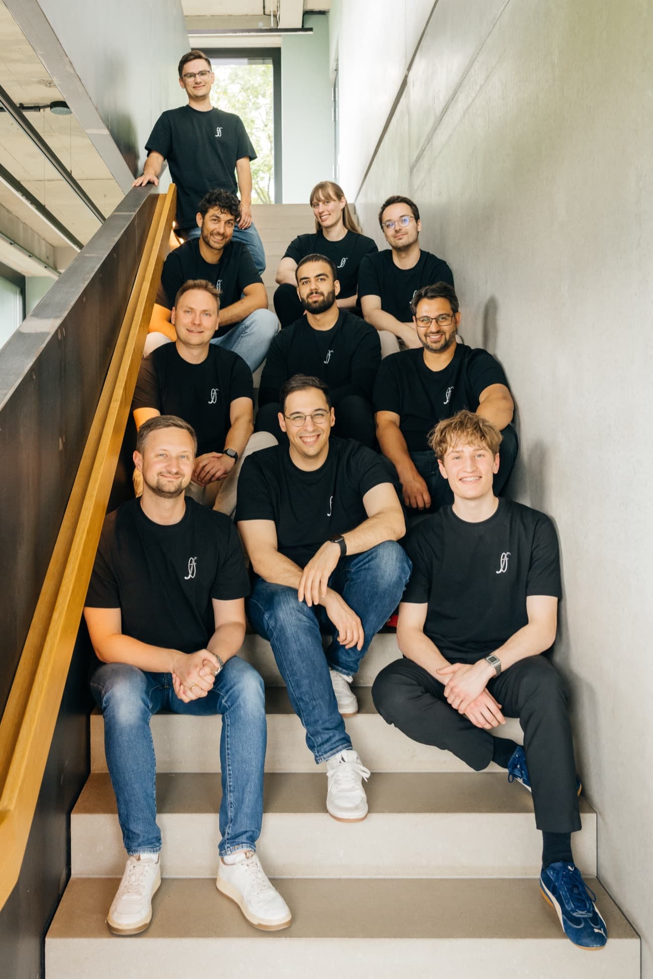 The Unfuture team on a staircase in the office.