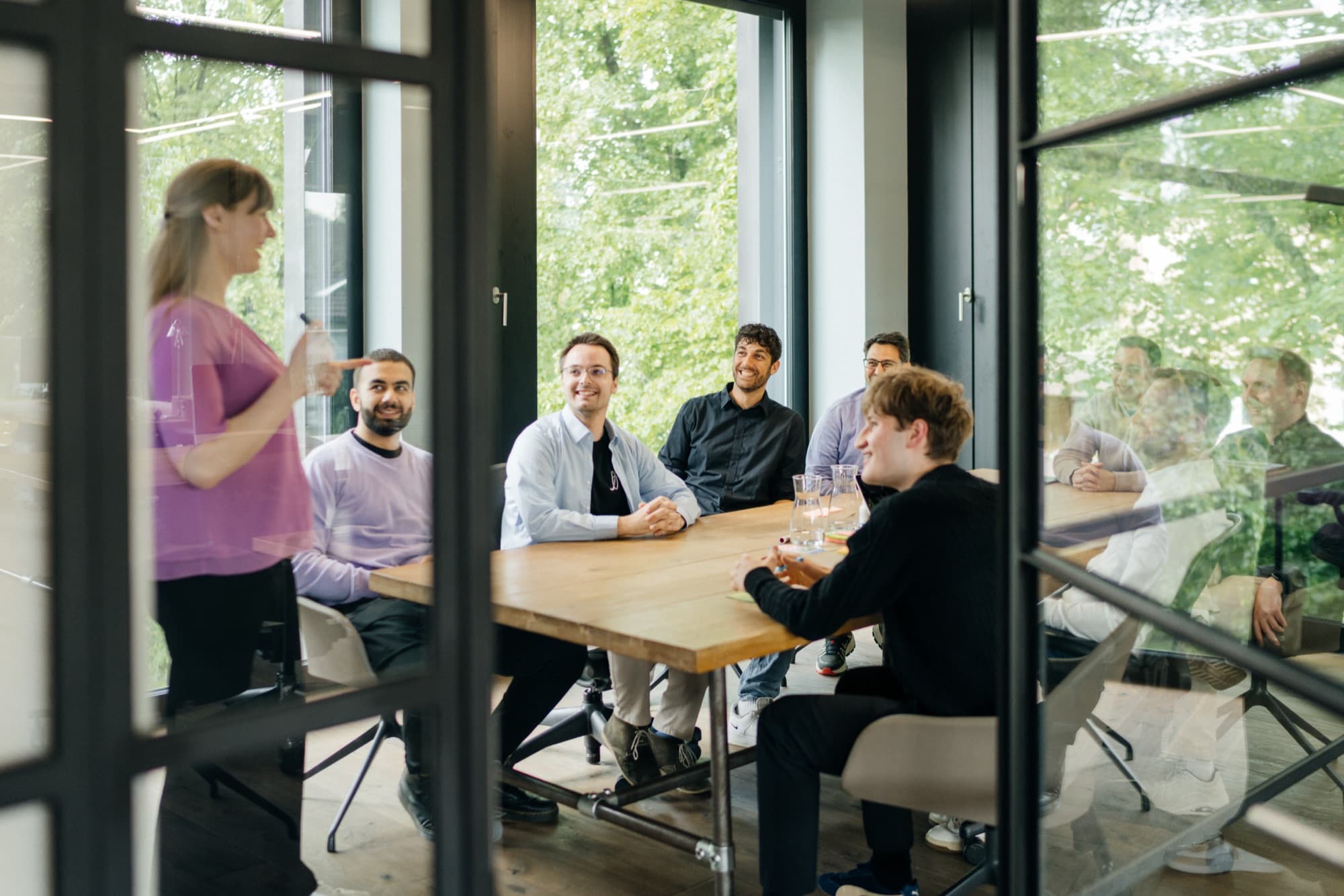 The Unfuture team in a shared workshop at the table.